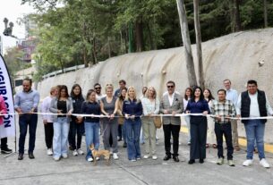 Dos taludes y una calle repavimentada en Huixquilucan